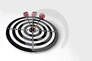 A game of darts with three flags of England on a white background