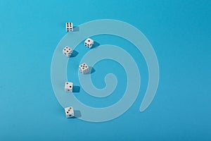 Game dice on color background top view