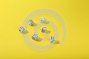 Game dice on color background top view
