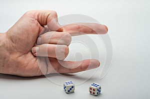 Game dice on which a combination of two sixes fell on a white background