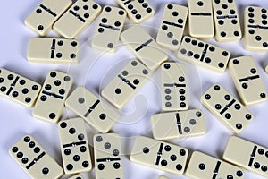 A game of dominoes on a light background. Close-up. Selective focus