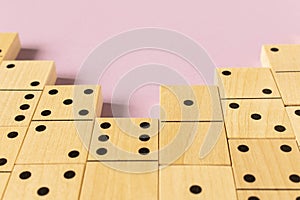 A game of dominoes on a light background. Close-up. Selective focus