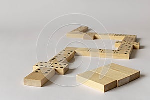 A game of dominoes on a light background. Close-up. Selective focus