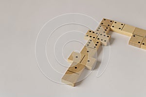 A game of dominoes on a light background. Close-up. Selective focus