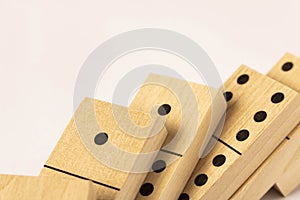 A game of dominoes on a light background. Close-up. Selective focus