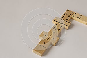 A game of dominoes on a light background. Close-up. Selective focus