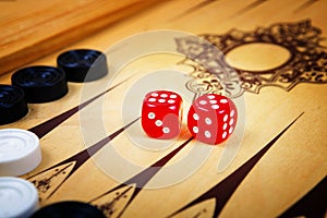 Game field in a backgammon with cubes and counters.