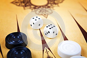 Game field in a backgammon with cubes and counters.