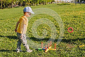 Game kid boy fun grass. family toss