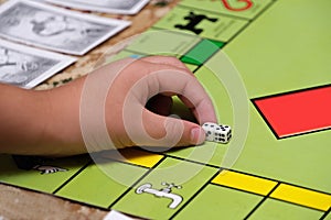 Game monopoly, game chips and dice on the table