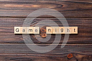 Game Night word written on wood block. Game Night text on wooden table for your desing, concept