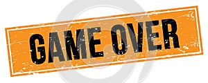 GAME OVER text on black orange grungy rectangle stamp