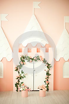 Game room with a pink castle for children. Children`s room for a little princess. Decorations for a child`s party. Little princess