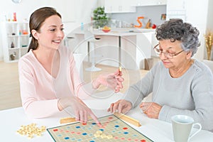 Game scrabble with old woman photo