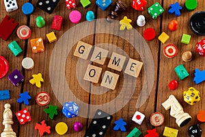 `Game On` spelled out in wooden letter tiles
