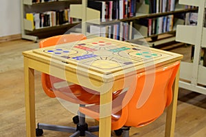 Game table in the reading room of the public library.