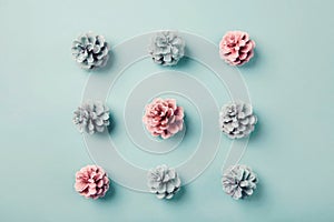 Game of tic-tac-toe presented with pink and blue pine cones photo