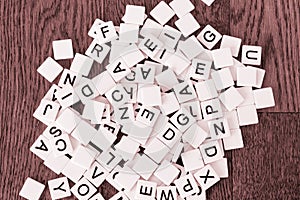 Game tiles with letters dumped onto a table