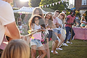 Game Of Tug Of War At Summer Garden Fete photo