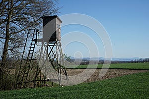 Gamekeepers hideout with ladder at the field and forest border