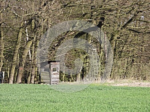 Gamekeepers shack at the border of a field and forest