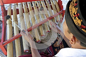 Gamelan Balinese Musicians playing wooden xylophone in Bali Indonesia