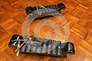 Gamelan Kiai Kanjeng. Traditional musical instruments from Indonesia. The frame is made of black painted wood, the blade is made