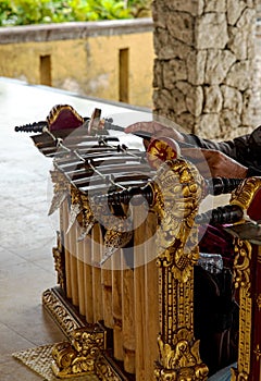 Gamelan music instrument surrounded by buildings under sunlight in Bali in Indonesia