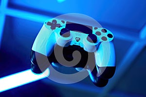 Gamepad on abstract background with light effects