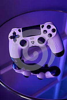 Gamepad on abstract background with light effects