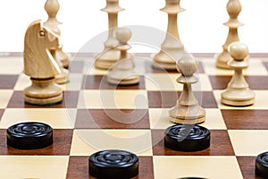 gameplay of chess and checkers on board closeup