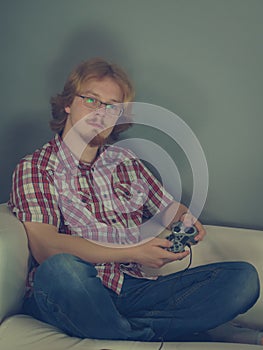 Gamer man playing using gaming pad