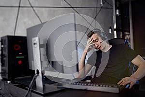 Gamer playing online video games on computer and feel depressed