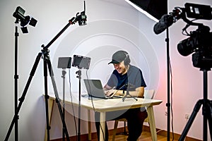 Gamer, streamer, or Youtuber streaming and recording in his studio