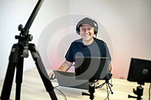 Gamer, streamer, or Youtuber streaming and recording in his studio photo