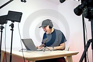 Gamer, streamer, or Youtuber streaming and recording in his studio photo