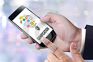 GAMIFICATION Businessman working at office desk and using computer and objects, Gamification Business Concept