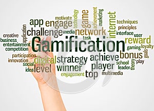 Gamification word cloud and hand with marker concept