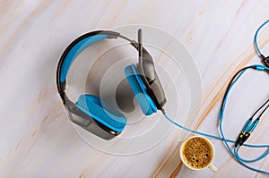 Gaming over ear headset with microphone on cup of coffee