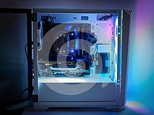 Gaming PC and CPU cooling fan with backlight. Desktop gaming computer with RGB led light inside. Concept of eSports