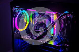 Gaming PC with RGB LED lights on a computer, assembled with hardware components photo