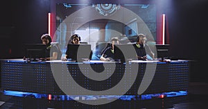 Gaming team playing FPS computer game