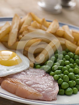 Gammon Steak Fried Egg Peas and Chips