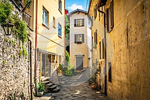 Gandria village scenic laneway with colorful houses and dramatic light in Gandria Ticino Switzerland photo