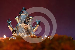 Ganesh idol shining due to oil lamp, festival season