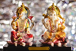 Ganesh-Luxmi statues on Bokeh Background - Dhan-teras concept