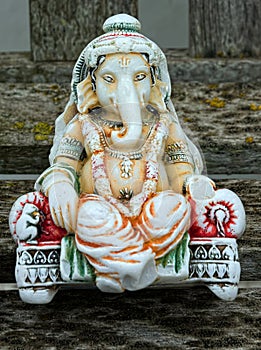 Ganesha. Hindu Deity, hand carved & painted statuette. photo