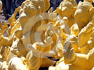 Ganesha idols drying in sun photo