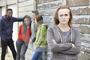 Gang Of Teenagers Hanging Out In Urban Environment