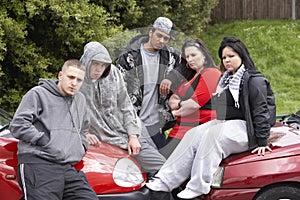 Gang Of Youths Sitting On Cars